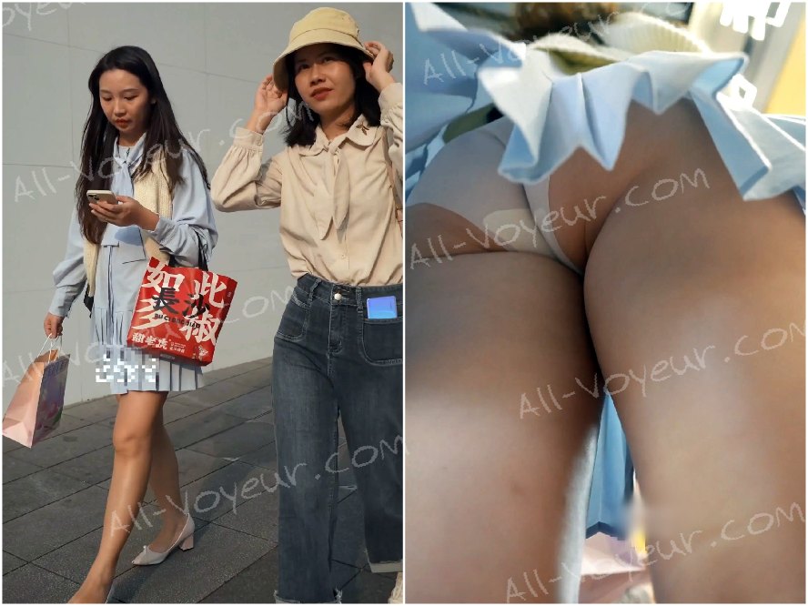 水色のプリーツスカートをはいた美しい女性が買い物をしていたところ、風に吹かれてスカートがめくれ上がり、下着が露わになってしまいました。彼女は何とか身を隠そうとしましたが、もう手遅れでした。