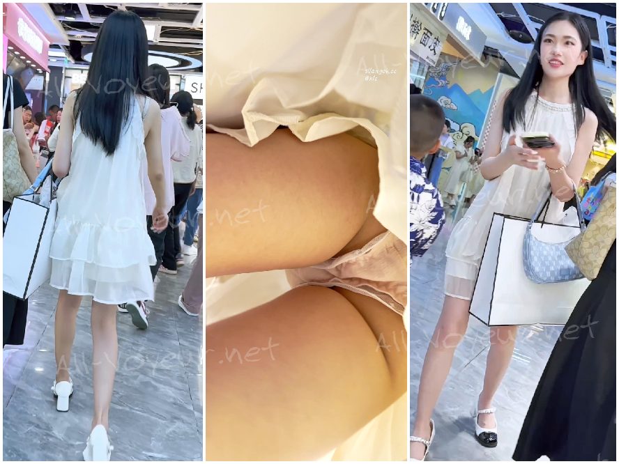 ロングドレスを着た美しい女性が親友と一緒に服を買いに出かけます。ピンクのレースで縁取られた裏地が透けています。