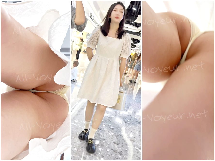 若い女性とその親友が買い物に出かけました。彼女は白いロングスカートを着て、その下に黄色い露出度の高いブラジャーを着けていました。前面はかなり黒ずんでいました。